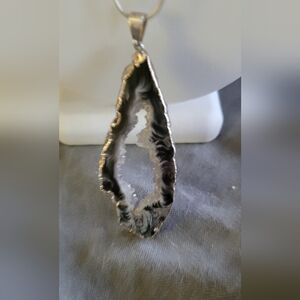 Geode pendant on silvertone snake chain